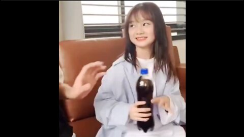 beautiful little girl is angry because her drink bottle is not opened