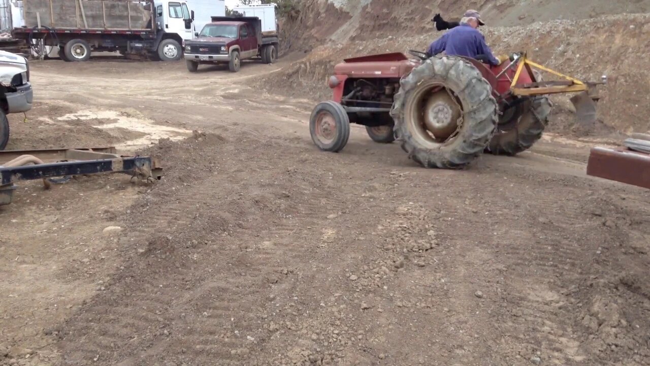 Massey Ferguson 35 Grading and setting up a Gantry with the Yanmar Excavator