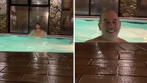 Dad hilariously photobombs jacuzzi video