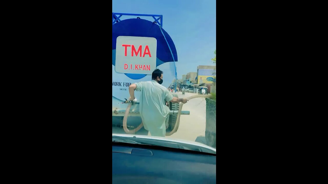 poor man giving water to plants in 44 temperatures
