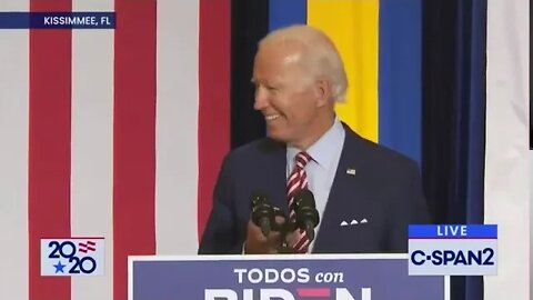 Biden learns how to play music on his phone