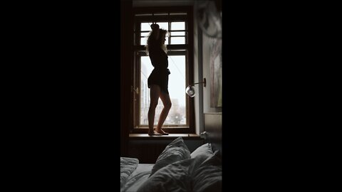 Beautiful Girl Dancing in Window