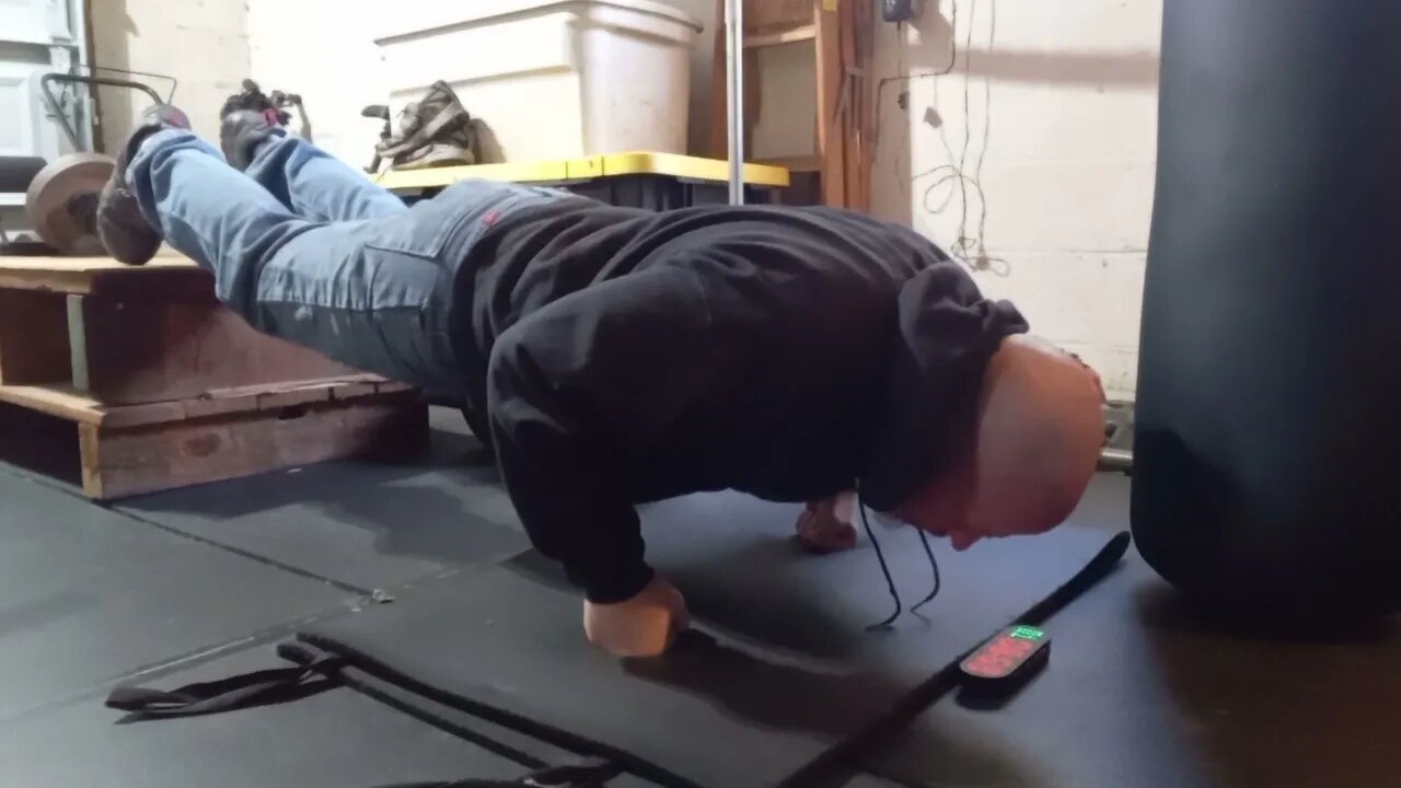 Knuckle Pushups Feet On 15" Bench 2 Minutes 12 Reps.