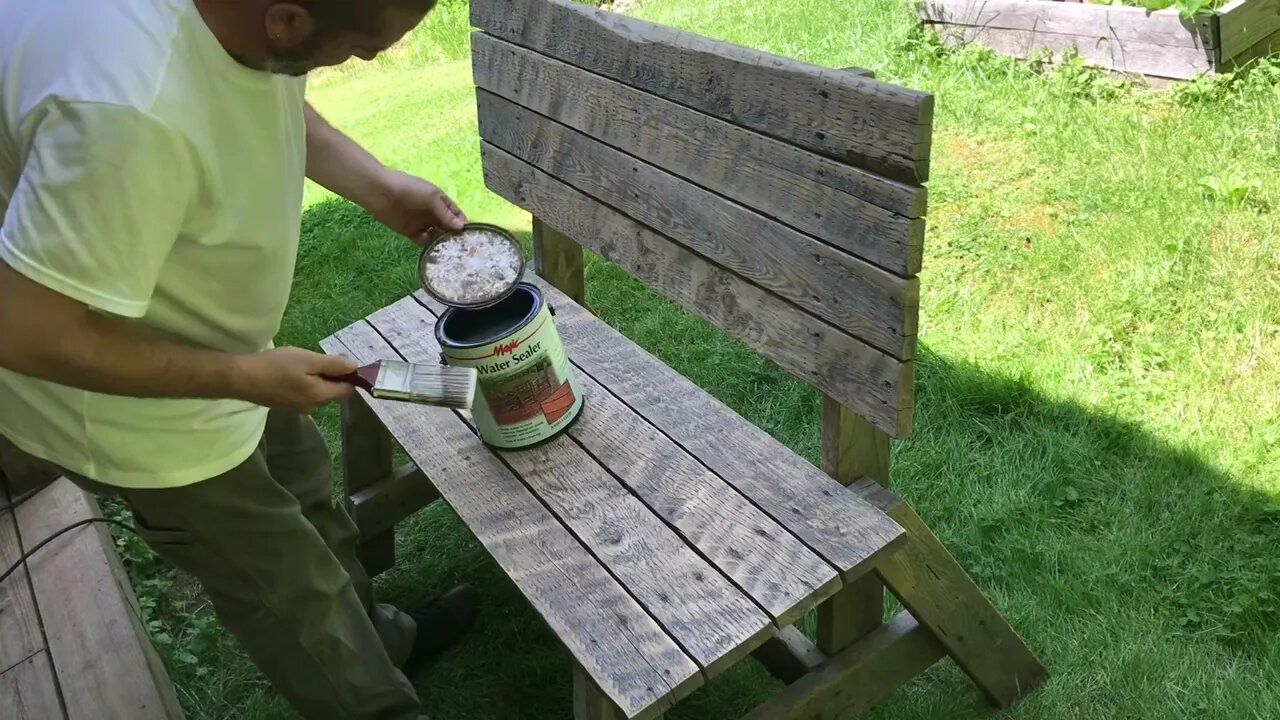 Water staining a Bench made from a pallet.