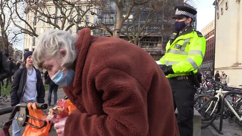 Old lady dispersed for feeding birds at Marble Arch