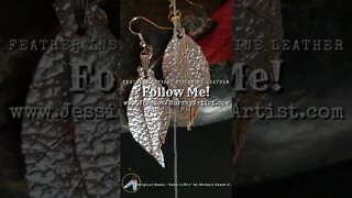 SILVER SHOWDOWN, 1 inch leather feather earrings
