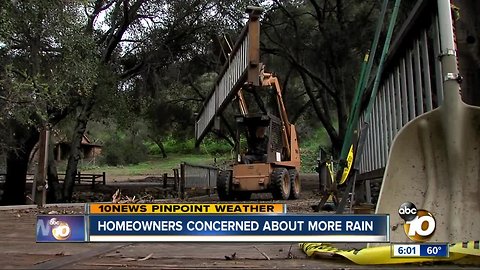 Homeowners clean up after massive storm
