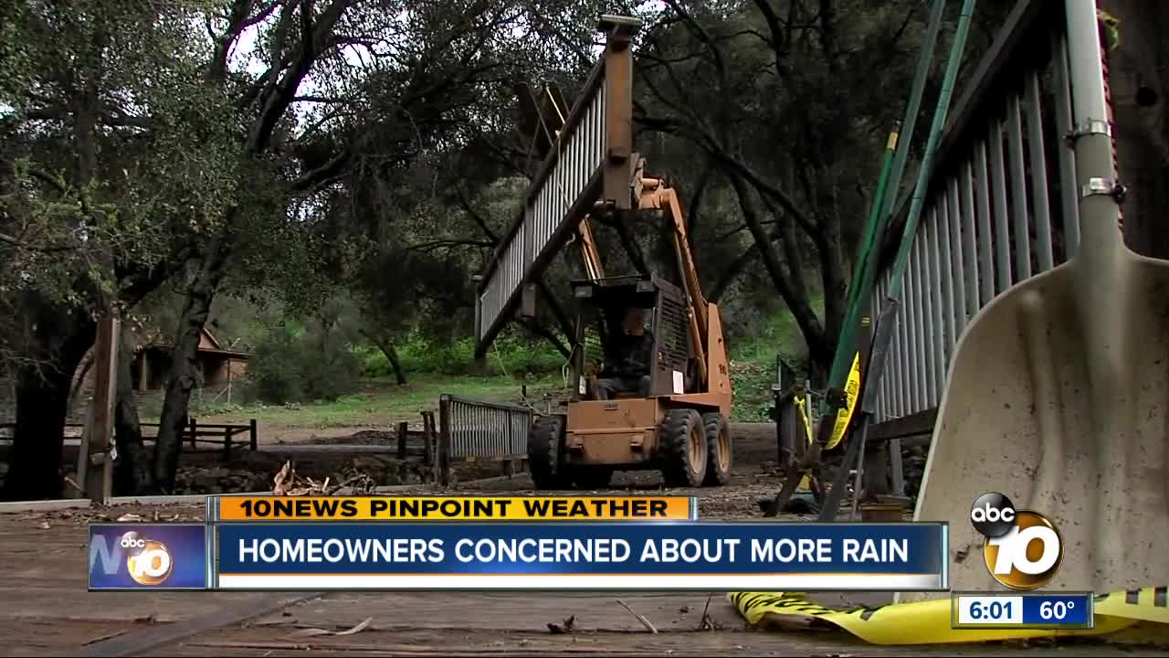 Homeowners clean up after massive storm