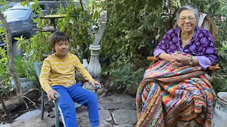 Budding landscaper helping create flagstone patio