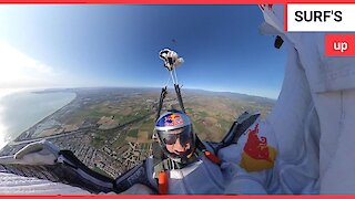 This is the moment a skydiver used his friend as a human SURFBOARD - 15,000ft above the Earth