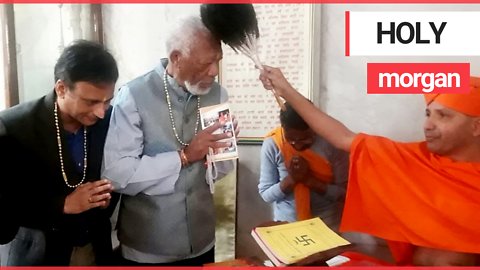 Morgan Freeman is blessed by a holy man in Nepal