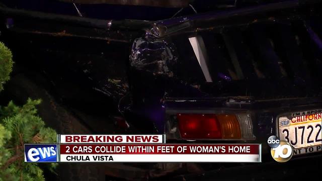2 cars collide within feet of woman's home