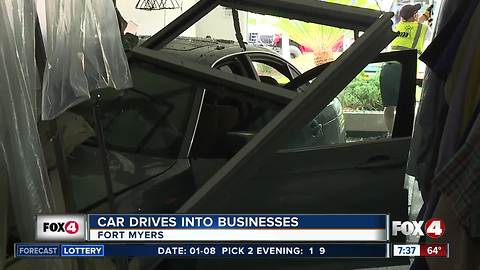 Car crashes through building into two businesses