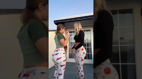 two hot girl dancing together