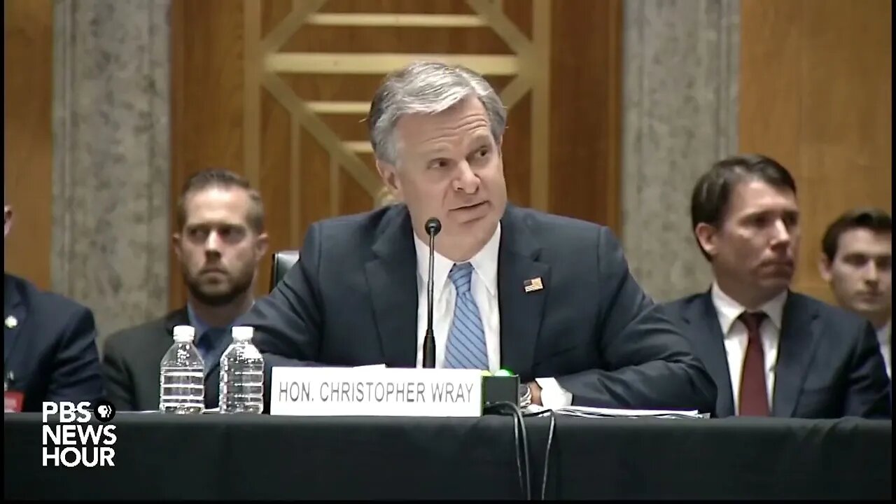 FBI Director Wray attacked for missing mandatory hearing to go on vacation