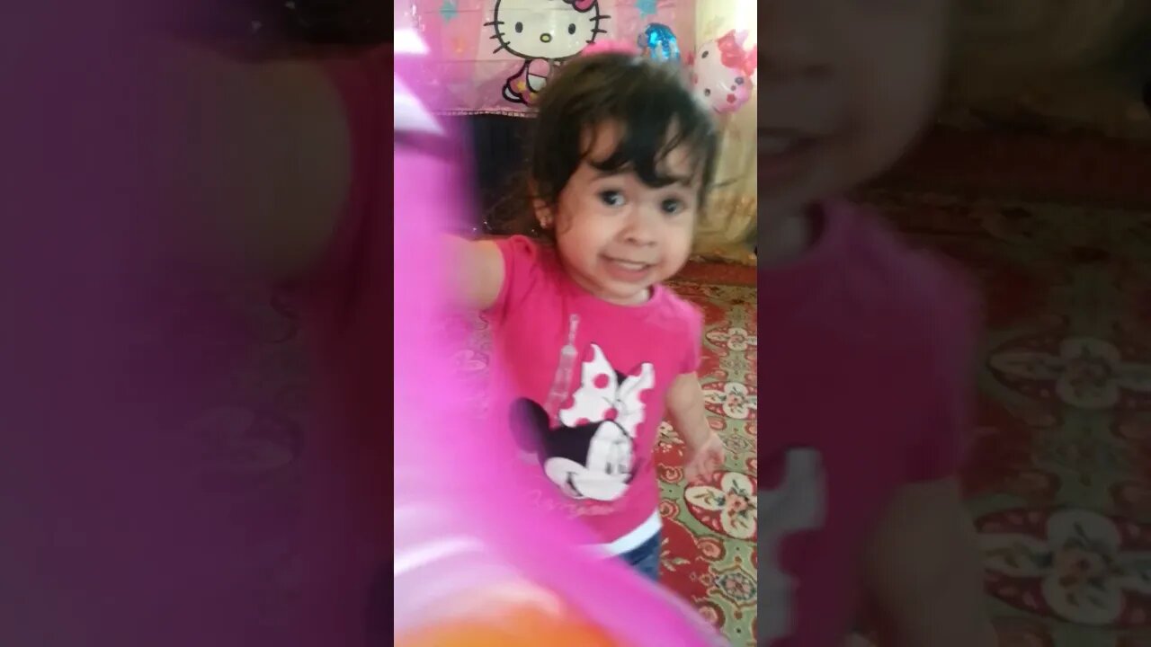 cute princess celebrates her second birthday and plays with baloons