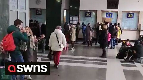 Kyiv Residents queue for tickets at the city's central station as Russian troops close in on Kyiv