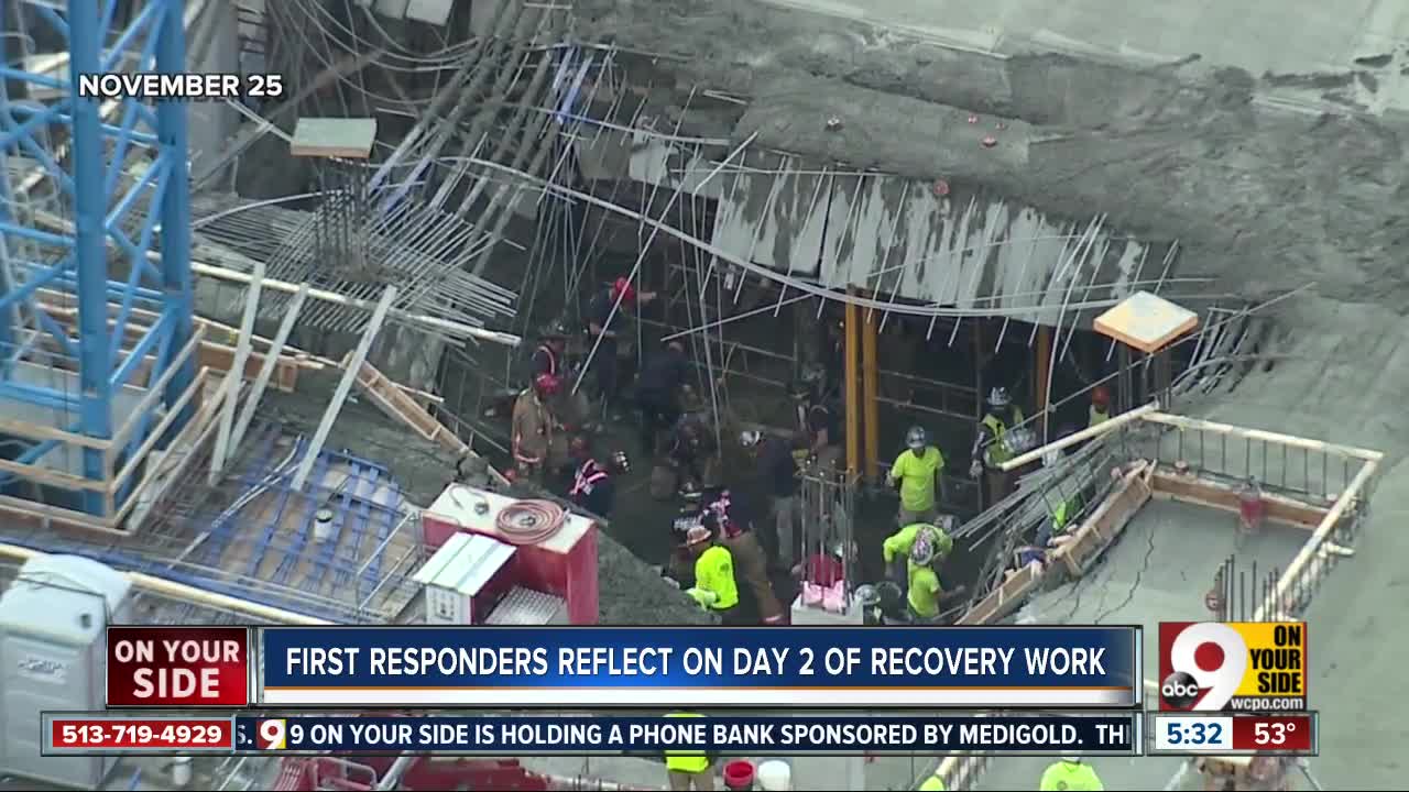 Urban Search and Rescue Teams aid in recovery efforts at building collapse site