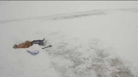 Kid realizes shoveling snow isn't as easy as it looks