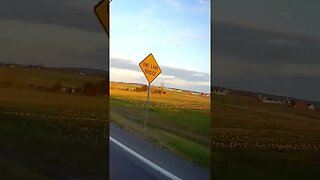 Riding Honda Grom Motorcycle with my shadow in Lancaster County PA at sunset with covered bridge