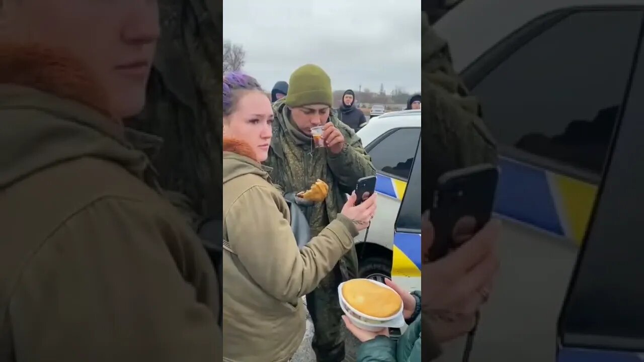 Ukrainians feeding captured Russian Soldier