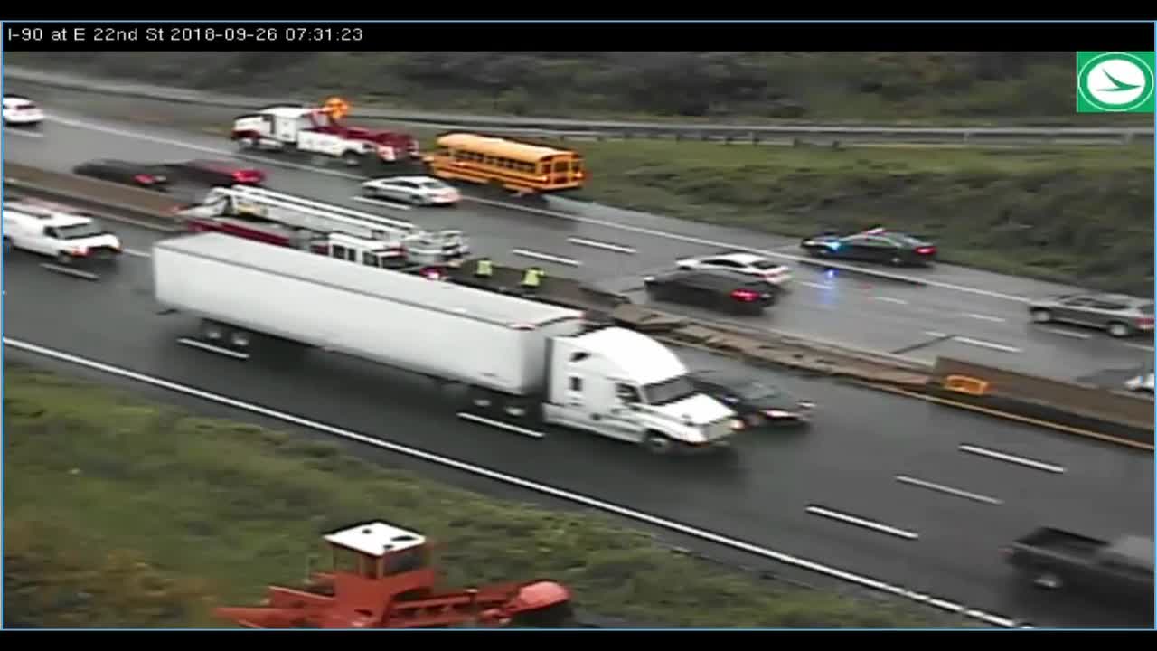 School bus crashes into a median, leaving concrete scattered across highway