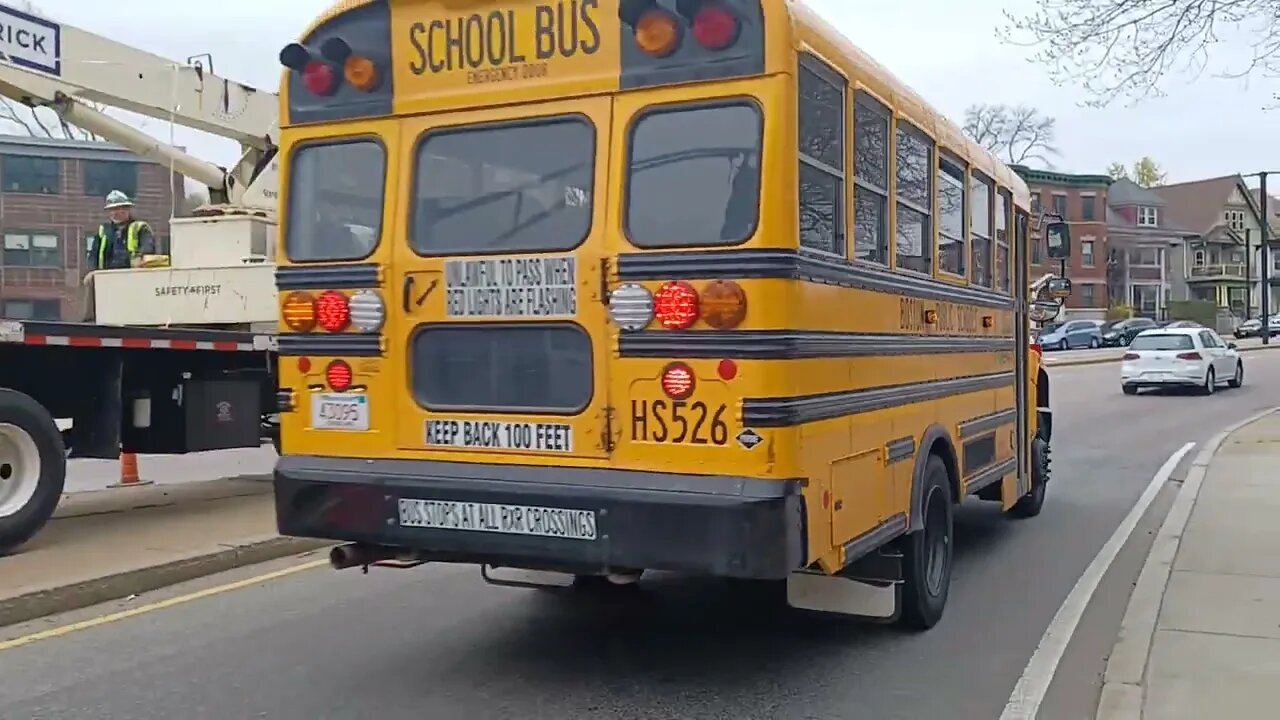 contractors replacing the base of a cell tower with a much larger one