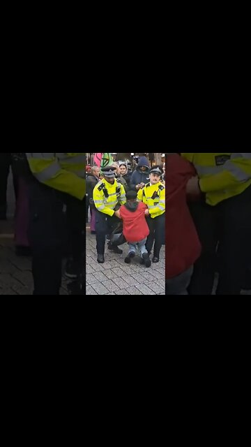Female stop oil protester carried by her arms #metpolice
