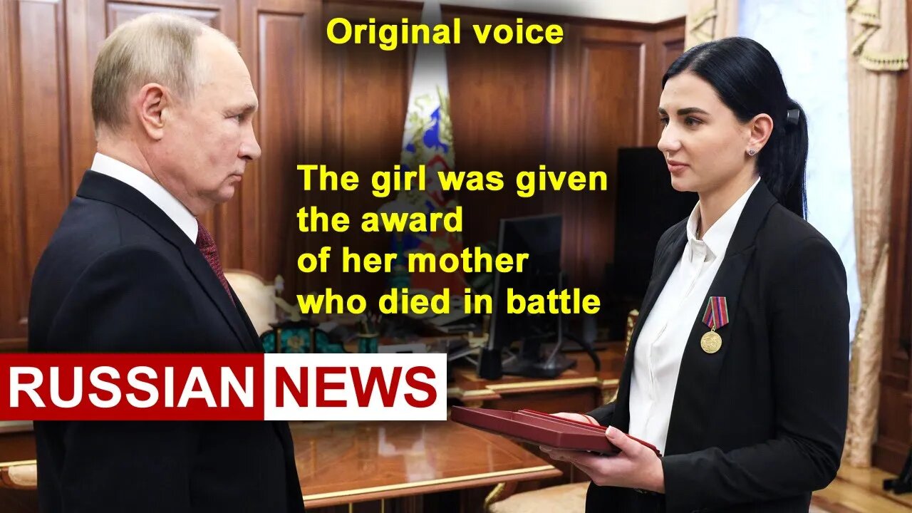 Putin gives the girl Star of the Hero of Russia, which belongs to her mother, who died in battle. RU