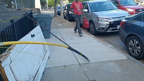 gas line hanging around on the sidewalk
