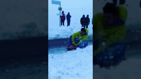 Sleeding on Iced Road Pulled by Car at 45MPH