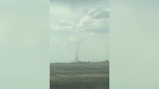 Huge dust devil looms on the horizon of Saskatchewan farmland