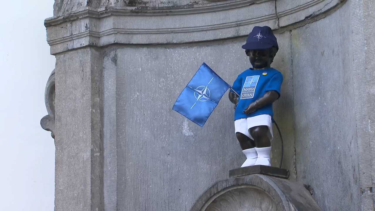 Statue of Manneken Pis is dressed up in his NATO costume .... PISS ON NATO!!!!