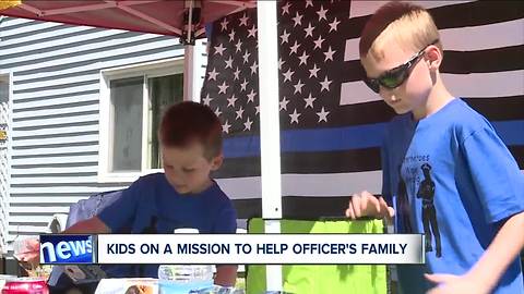 Boys open lemonade stand to help the family of a Cleveland police officer who died suddenly