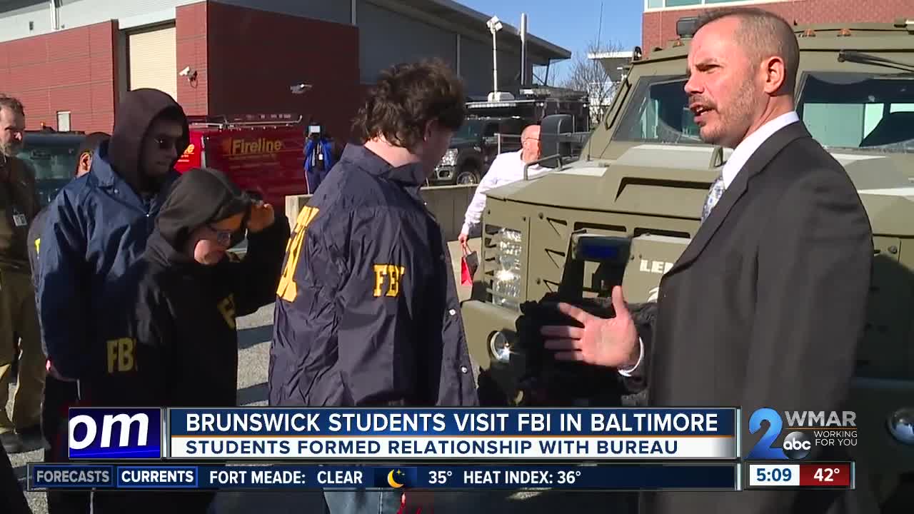 Baltimore FBI agents trade badges for gifts with special needs high school students