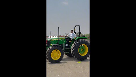 Beautiful John deee tractor on road