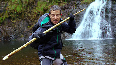 Watch Bear Grylls eat raw salmon after catching it with difficulty