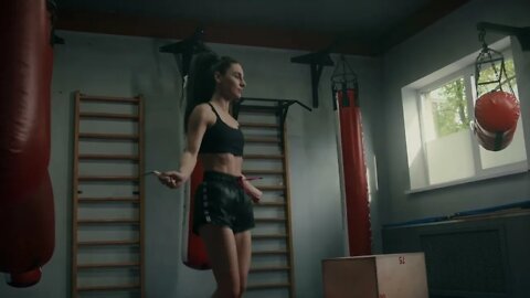 An Athletic Woman Skipping Rope