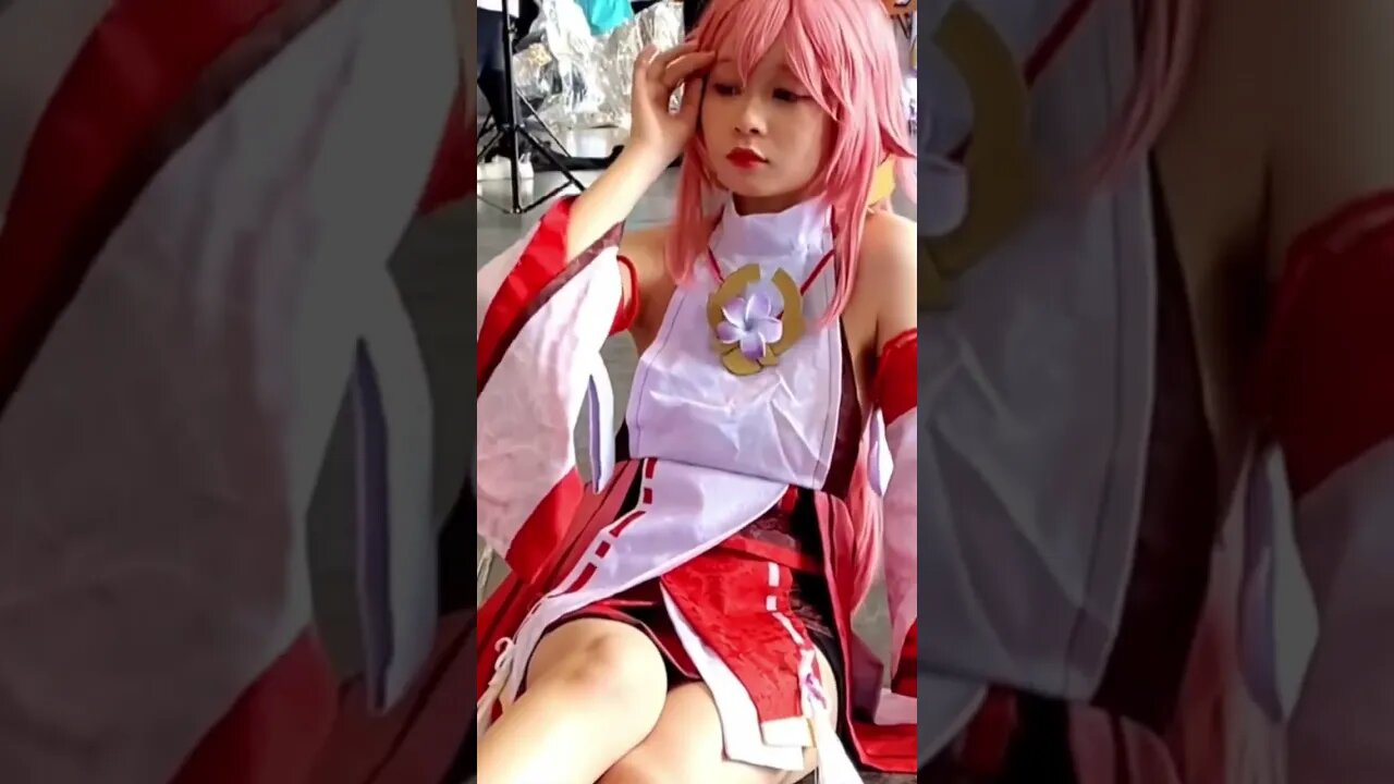 Cute Chinese Girl Sits On The Floor In Her Cosplay Costume