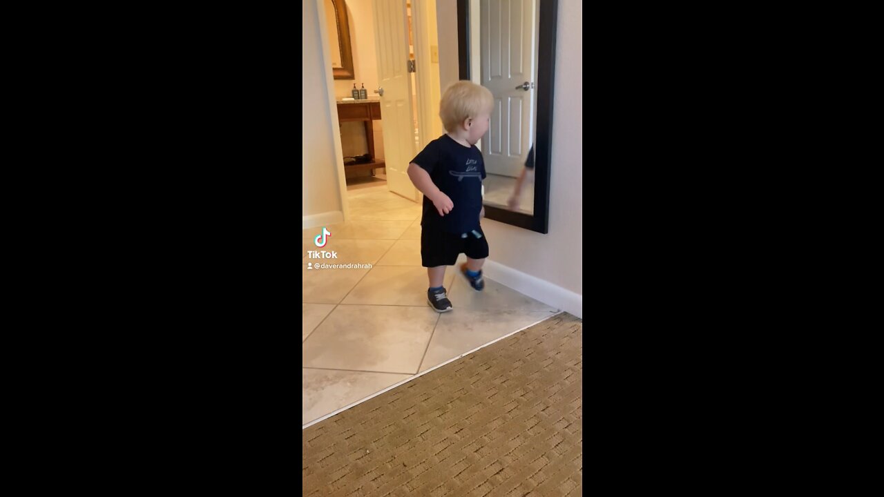 Toddler Dancing in front of Mirror