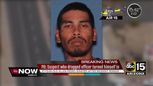 Suspect who dragged officer turns himself in