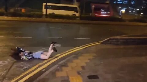 Woman slammed onto the ground due to extremely powerful winds due to Typhoon Saola