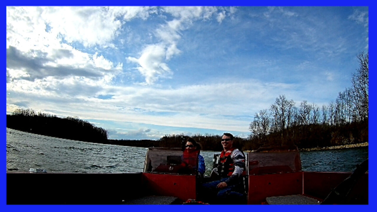 Beautiful Woman Driving a Bass Boat