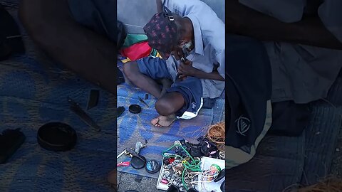 Cobbler stiching shoes