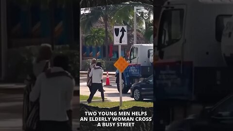 Two young men help an elderly woman cross the street. #shorts