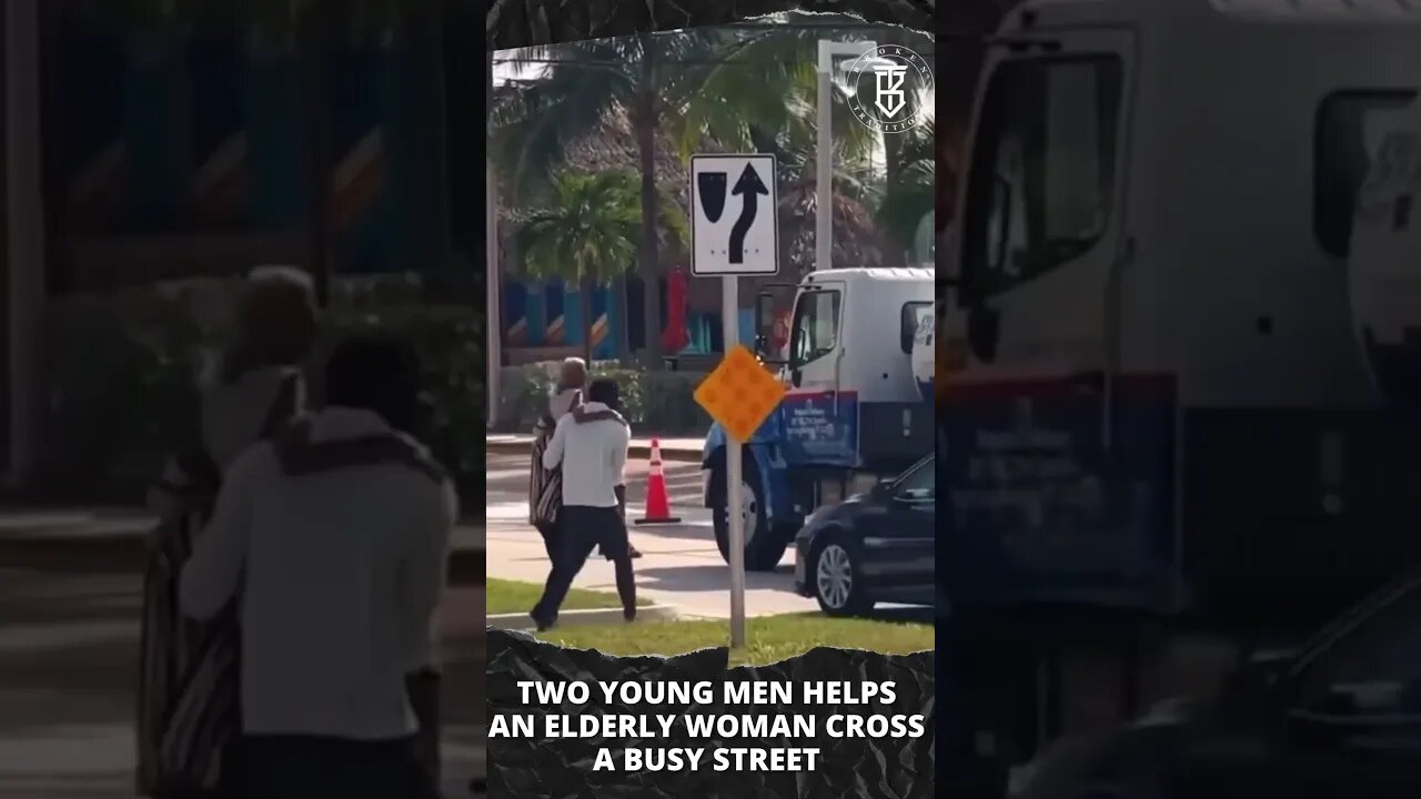 Two young men help an elderly woman cross the street. #shorts