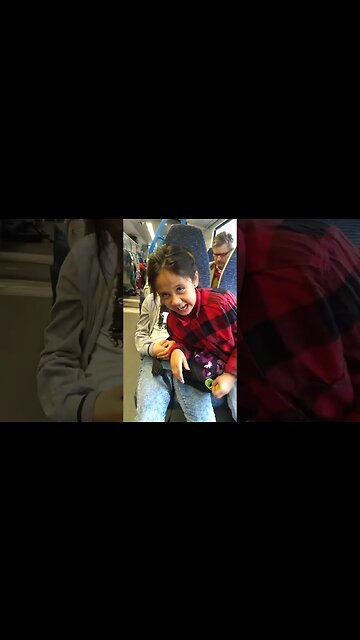 Baby girls, sisters laugh and joke in the train