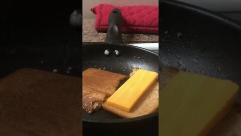 Lu makes a grilled cheese sandwhich