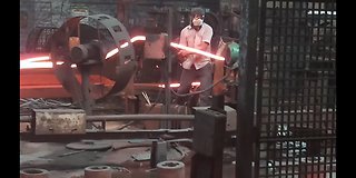 Man Working with red hot iron