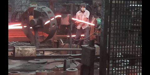 Man Working with red hot iron